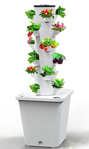 White hydroponic vertical garden tower with planting pockets and reservoir; plants shown for illustration