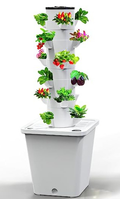White hydroponic vertical garden tower with planting pockets and reservoir; plants shown for illustration